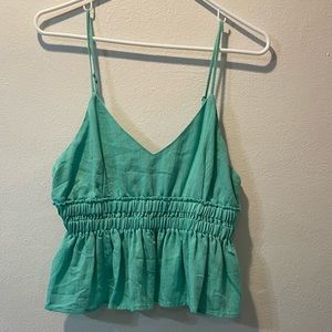 Green tank top.